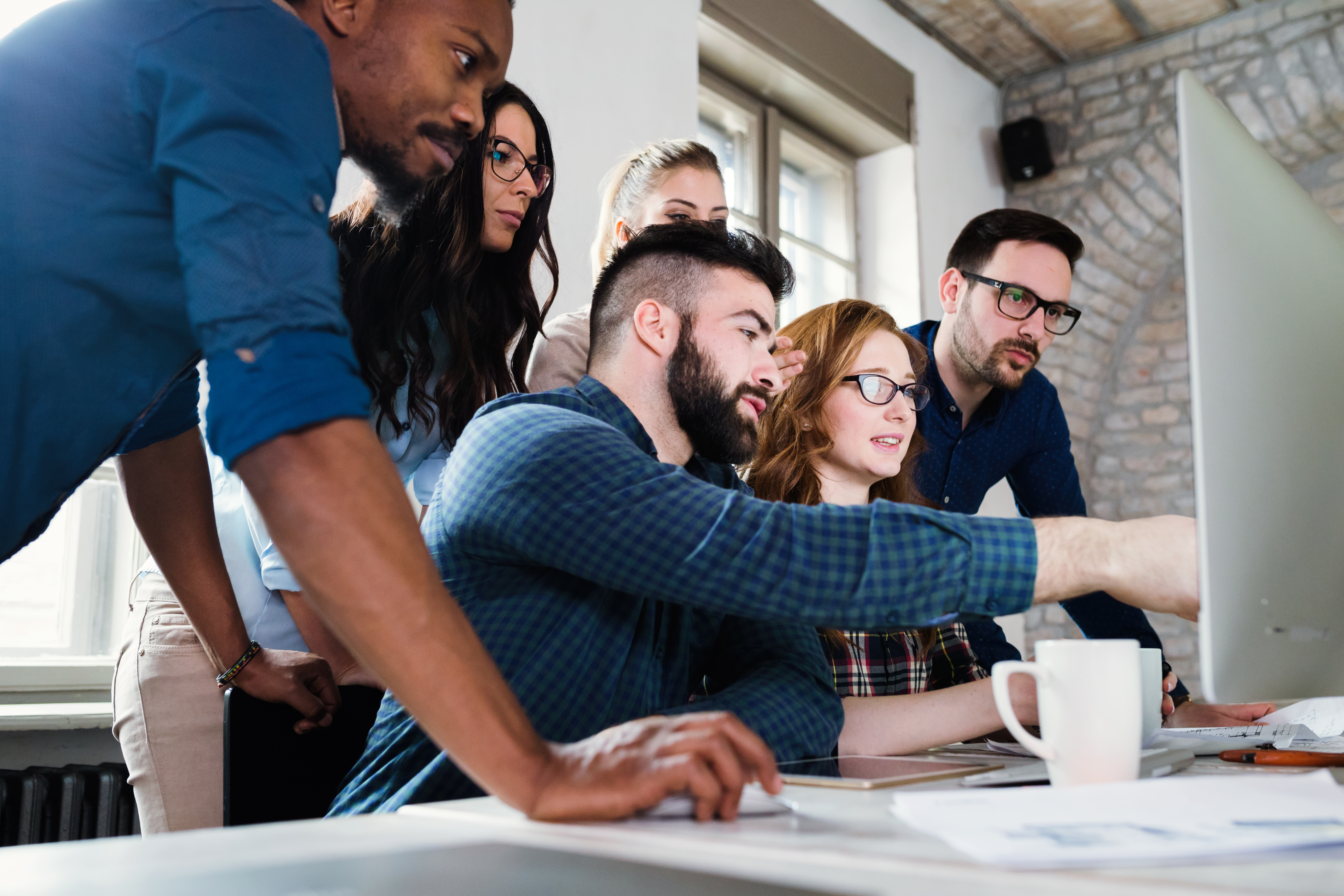 young-architects-working-project-office-together